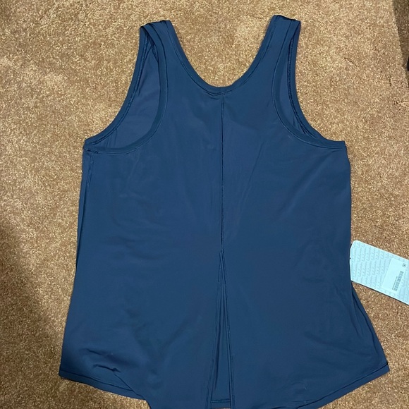 lululemon athletica Tops - NWT. Women’s Lululemon tank top. Size 6. Dark blue or black in color. Not sure .